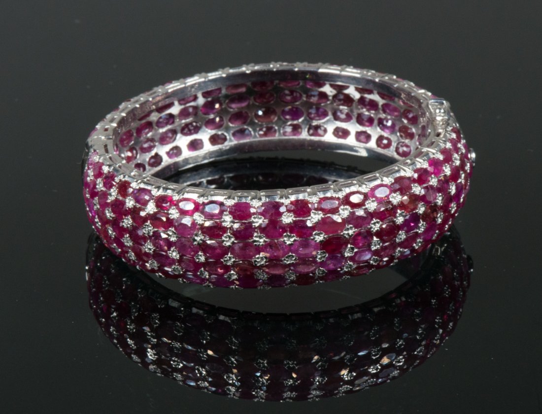 Sterling Silver Ruby Bangle with Certificate: Sterling Silver Ruby Bangle; appraised $5400; D: 7 cm, 48.73 grams; accompanied with certificate