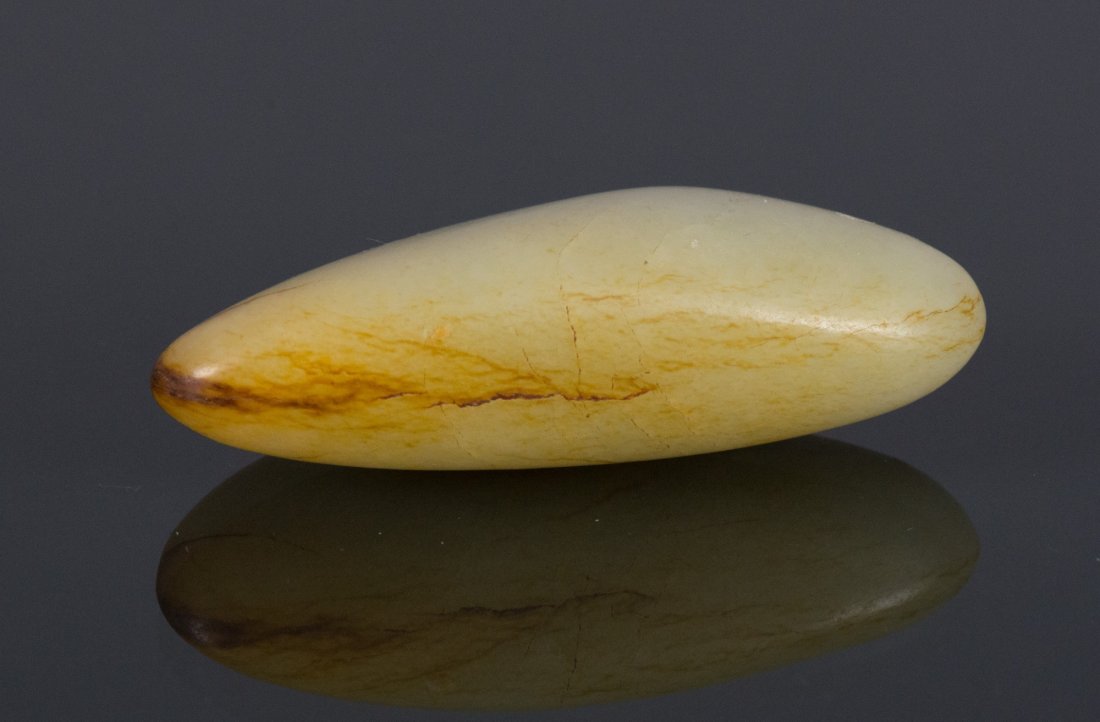 Chinese Hetian Jade Carved Pebble Boulder: 和田玉石块 Chinese Hetian jade carved pebble boulder; of translucent white tone with mutton fat suffusions; H: 7 cm, W: 3 cm, 73 grams