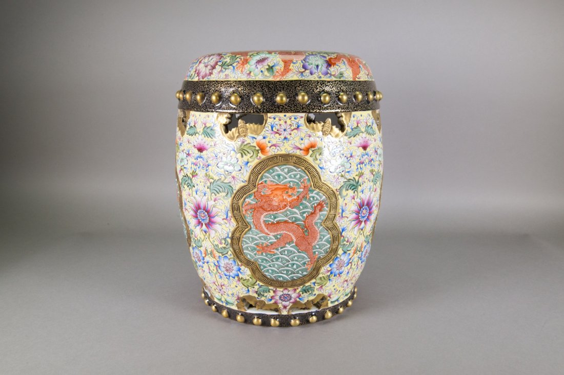 Chinese Famille Rose Dragon Stool Qianlong Mark: Chinese Famille Rose enameled porcelain dragon stool; of cylindrical form; featuring dragons and flowers patterns; four-character Qianlong mark with seven-character National Museum mark on base; H: 35