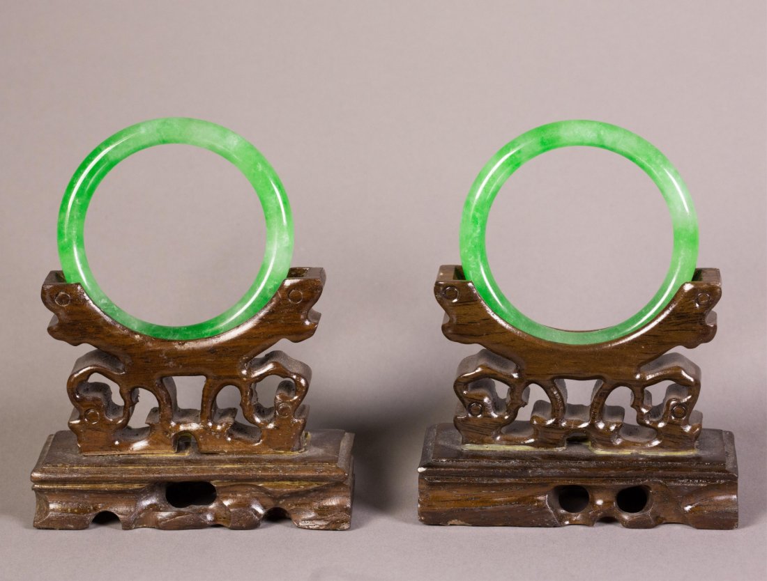 Pair of Chinese Apple Green Jadeite Bangle: Pair of Chinese apple green jadeite bangles; of rounded edge; D: 6.5 cm, Inner D: 5 cm, 54 grams both
