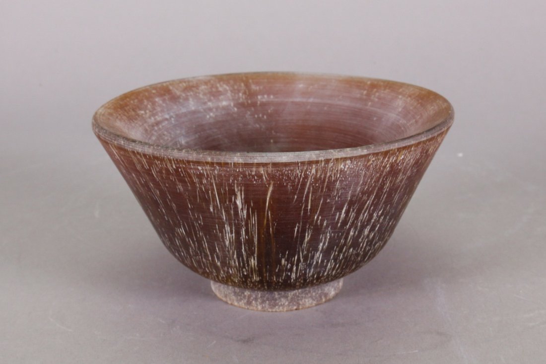 Chinese Horn Carved Cup: Chinese horn carved libation cup; supported on short foot rim; of dark brown tone with light yellow grain; H: 7 cm, D: 13 cm, 358 grams