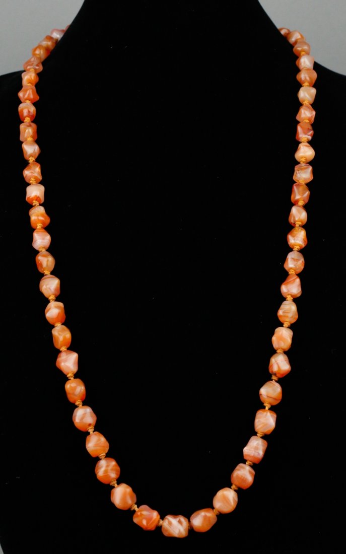 Chinese 19th C. Agate Necklace w/ Silver Clasp: Chinese agate necklace; comprised of natural form agate beads; of pink orange tone; with flower silver clasp; 19th century; D: 28 cm, 97 grams