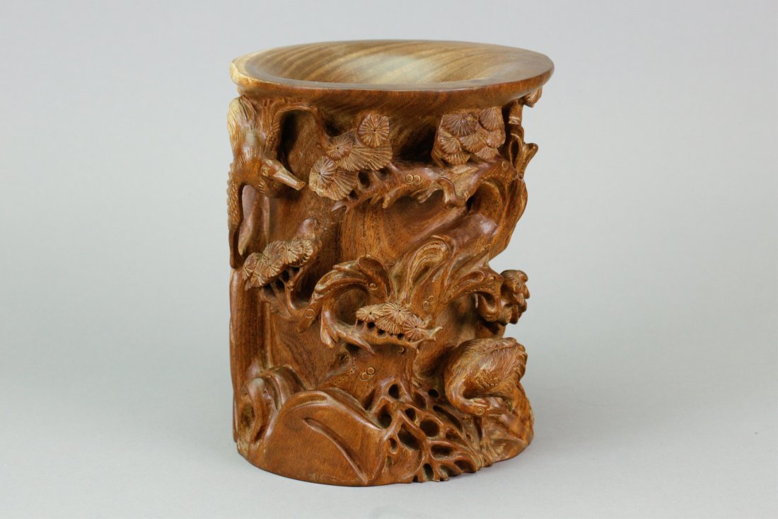 Chinese Old Huanghuali Carved Brushpot: Chinese old Huanghuali wood carved brushpot; of cylindrical form; featuring crane and pine trees in high relief; H: 16 cm, D: 17 cm, 1617 grams