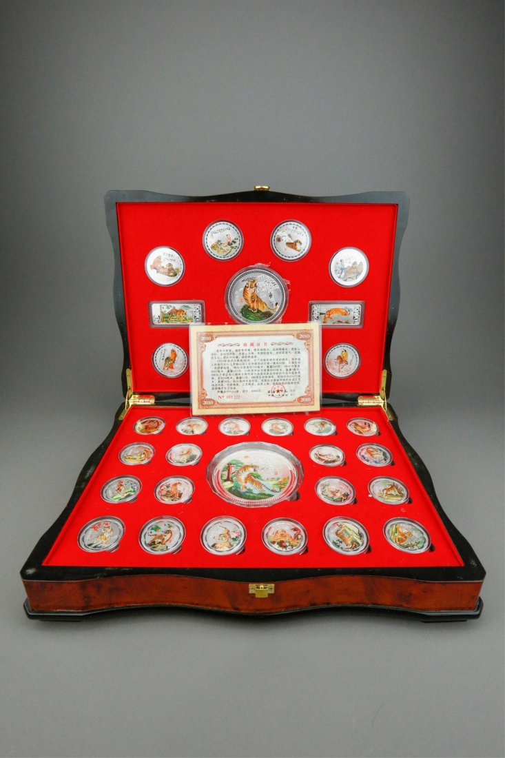 Chinese Tiger Silvered Coin Collections w/ Case &: Chinese tiger silvered coins collection set; comprised of twenty-eight regular-sized coins with drawings of figures and tigers, two large coins with 500 grams mark and two rectangular coins; collectio