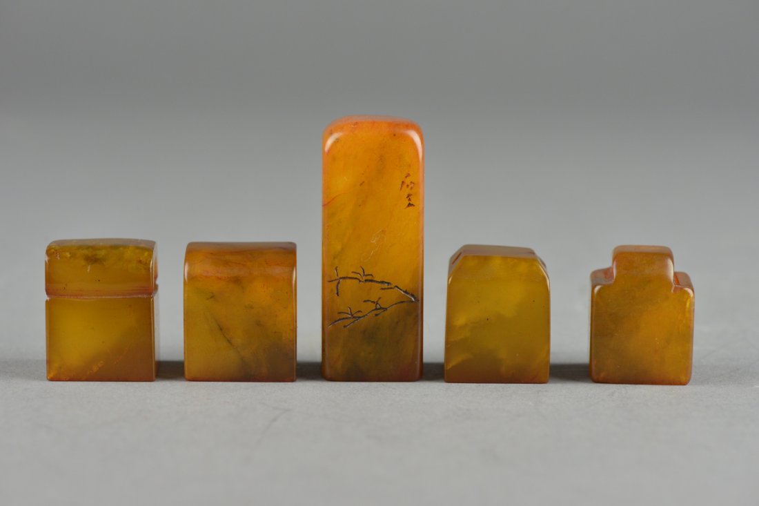 Set of Five Chinese Carved Tianhuang Stone Seals: Set of five Chinese carved Tianhuang stone, of various square forms with a domed top featuring notched handles, incised mark on one side of all five seals, the stone of rich toffee tone. H: 5 cm, 52 g