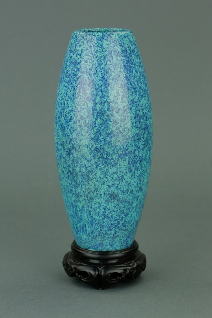 Chinese Egg Blue Vase w/ Stand: Chinese egg blue porcelain vase; of oval form; featuring splash blue glaze on body; six-character Qianlong mark on base; custom made wood stand included; H: 19 cm, D: 8 cm, 378 grams