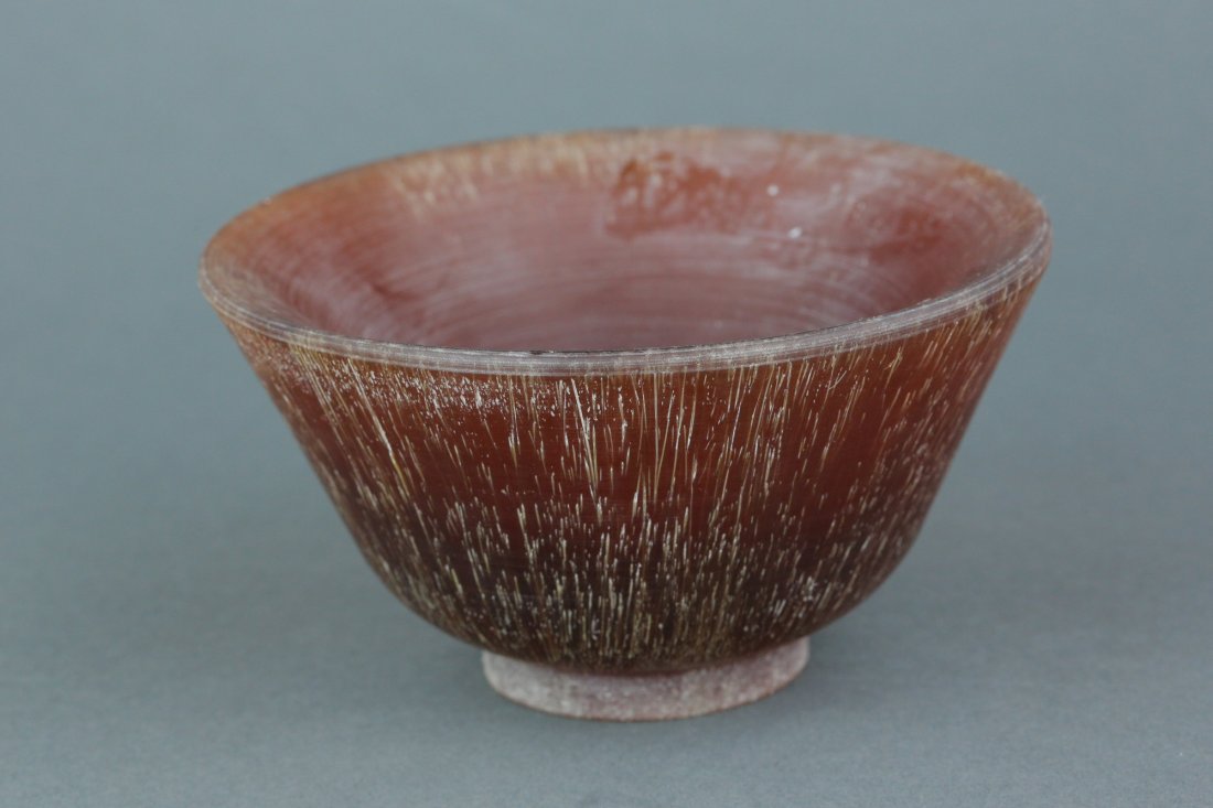 Chinese Horn Carved Cup: Chinese horn carved cup; supported on low foot rim; of dark brown tone; H: 6.5 cm, D: 11 cm, 365 grams