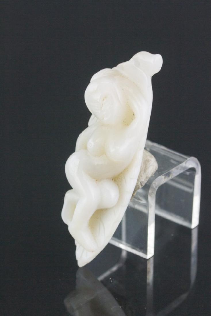 Chinese White Jade Carved Nude Women Pendant: Chinese white jade pendant; carved with high relief reclined sleeping woman on a leaf; of white tone; pierced for suspension; D: 3.25 cm, Inner D: 2.75 cm, 23 grams, Density: 2.92