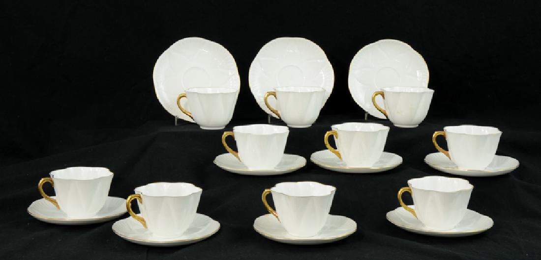 Ten Shelley Bone China Tea Cups: 20th Century, White Teacups and saucers with green mark: FINE BONE CHINA Shelley ENGLAND. cups measure 2.5" x 4" and saucers are 5.75" diameter. No Chips, cracks, or repairs. Estate Fresh, dusty. Ship