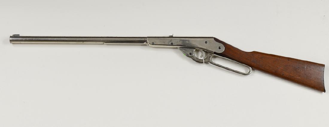100 Shot Daisy Model "B" BB Rifle: Lever Action, nickel plated BB Rifle, Early 20th Century. Steel Buttplate, Sheet metal rear sight, 40-50% condition. not tested. 36" long overall, Shipping weight 2.5 pounds. Keywords: BB Gun, Rifle, 