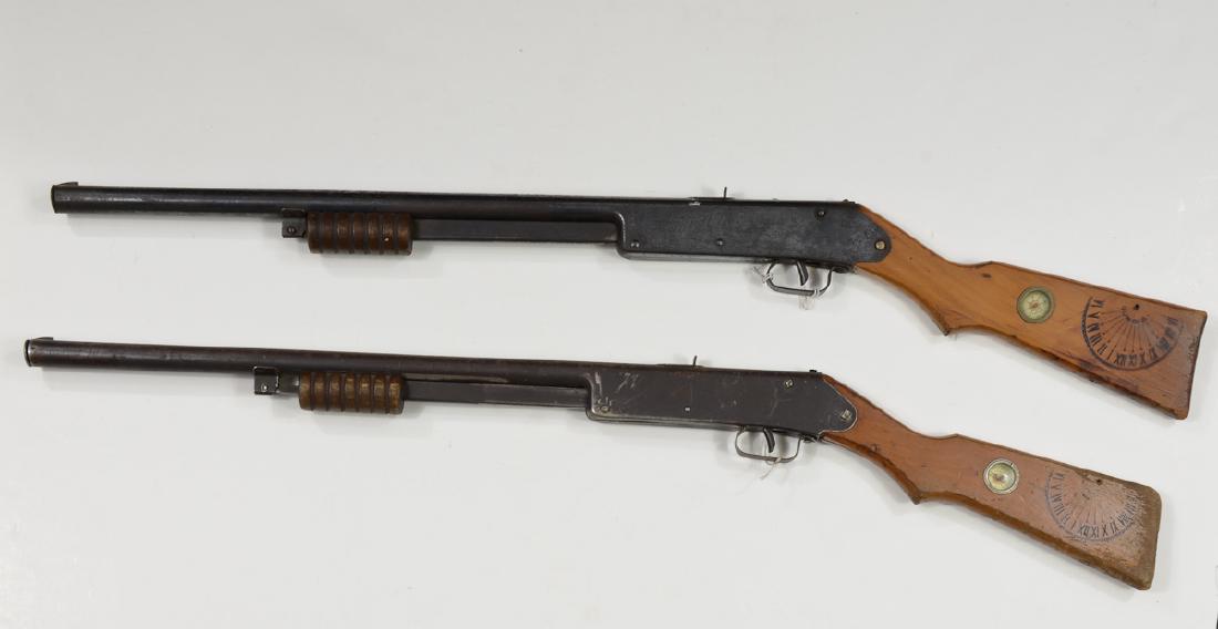 Two Daisy Model 107 Buck Jones Special BB Guns: Pump Action with engraved receivers, wood stock with compass, each in 30-40% Condition, not tested. 36" Keywords: BB Gun, Rifle, Pistol, Airgun, Air Gun, Pellet, soft, target