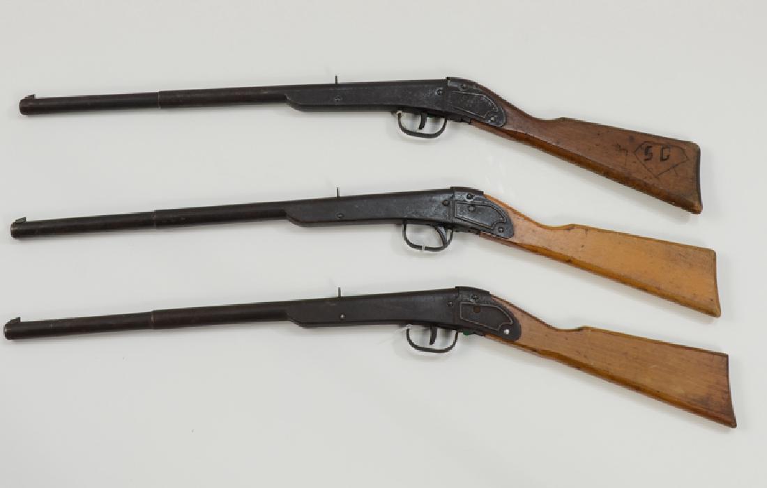 Three Daisy BB Guns: Each No. 100 Model 38, single shot, wood stock, in 30% - 40% Condition. Length: 31" Keywords: BB Gun, Rifle, Pistol, Airgun, Air Gun, Pellet, soft, target