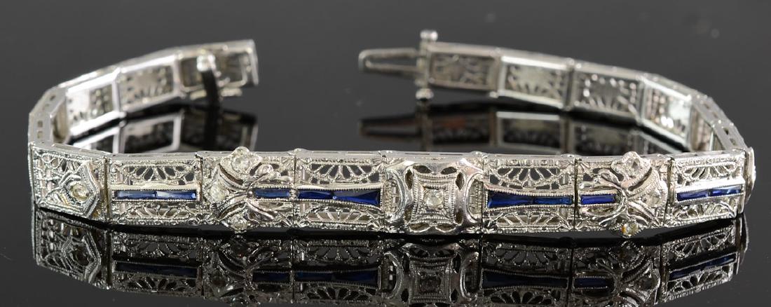 Antique Ladies Art Deco Sapphire Bracelet: 1920's or 1930's period 14K White Gold with excellent detail. Very good, wearable condition, 7" length. Diamonds and Blue Sapphires. Hallmarked 14K. 12.9 grams / 8.2 dwt. total. Keywords: Estate, Jewe