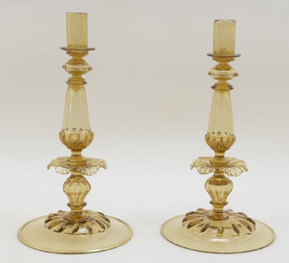 Pair of Venetian Glass Candlesticks: Amber glass, Early 20th Century, Italy. Girandoles not present. Each 16" tall, 8" wide. No visible cracks, chips, or repairs. Keywords: Italian, Murano, Antique