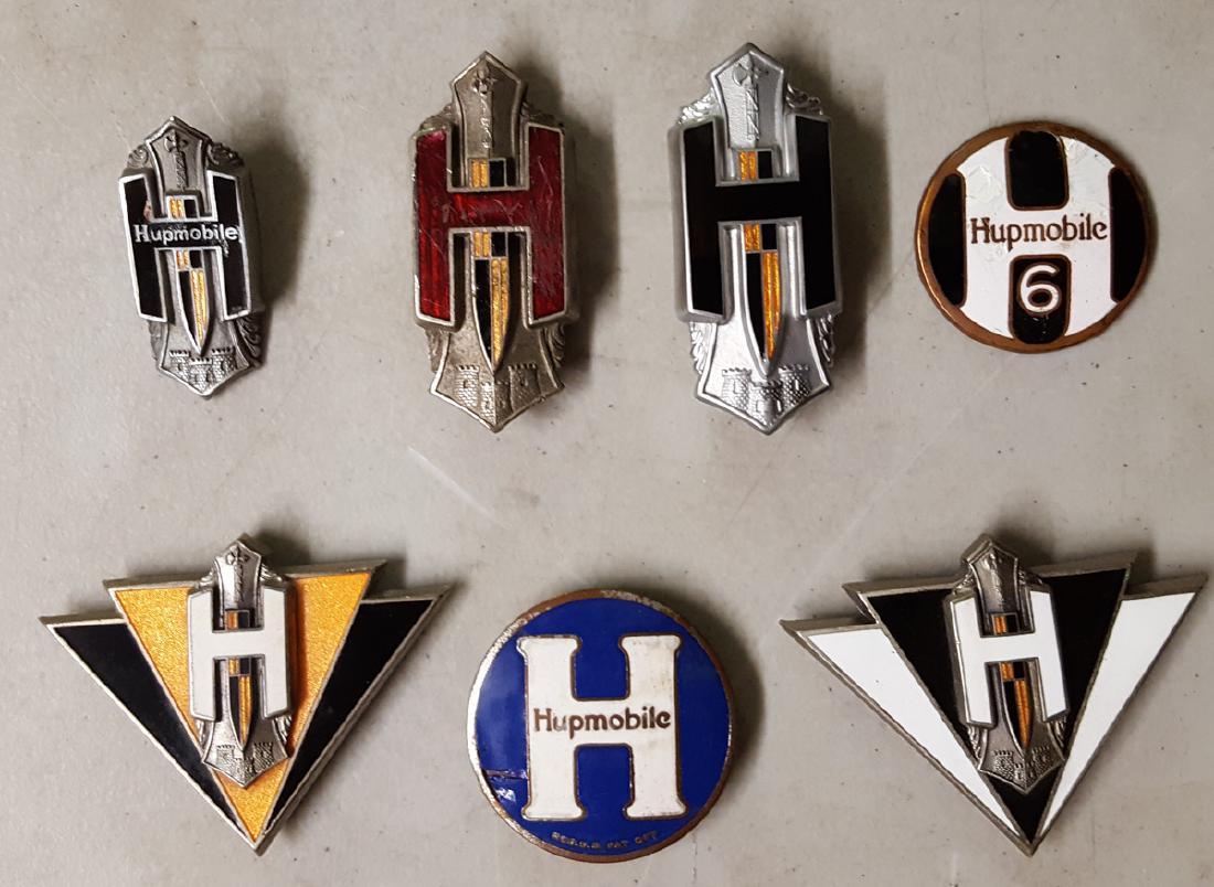 Seven Hupmobile radiator badges (1 of 2)