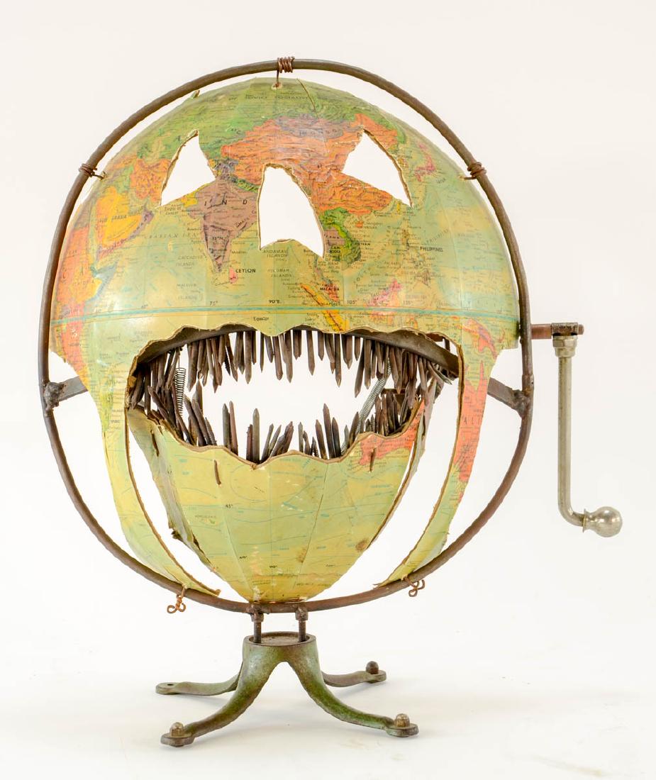 Chris Hausbeck Outsider Art: Titled "The Pumpkin of Swift Retribution" and signed by artist Chris Hausbeck. This is a fantastic Jack O Lantern made from welded and cut steel, nails, and an old globe. The handle makes the jaws ope