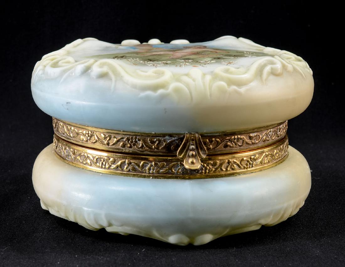 CF Monroe Wavecrest Dresser Box w/ Cupid: Antique American Molded glass dresser box by C.F. Monroe of Meriden CT. rare cupid decoration, Black Wave Crest Trade Mark Stamp to base. gilt metal mounts, good hinge. VG-EX condition with some minor