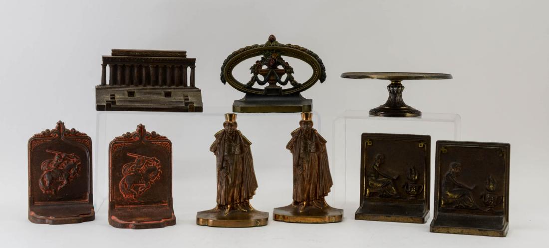 Bradley & Hubbard Cast Iron Group: An Excellent and large group of Painted Cast Iron Bradley & Hubbard items including: a pair of Arabian Horse and rider bookends, a Classical Pattern Tazza, a Floral Swag Doorstop, a Pair of Plated fig