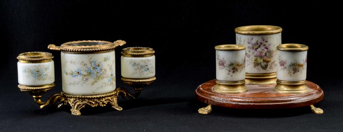 Two C. F. Monroe Smoking Sets: Two Antique cigarette and Match Holder sets by CF Monroe of Meriden CT. One glass with Gilt metal mounts, with Wavecrest stamp to base. 4" tall, 8" wide. good condition, with some repainting to center