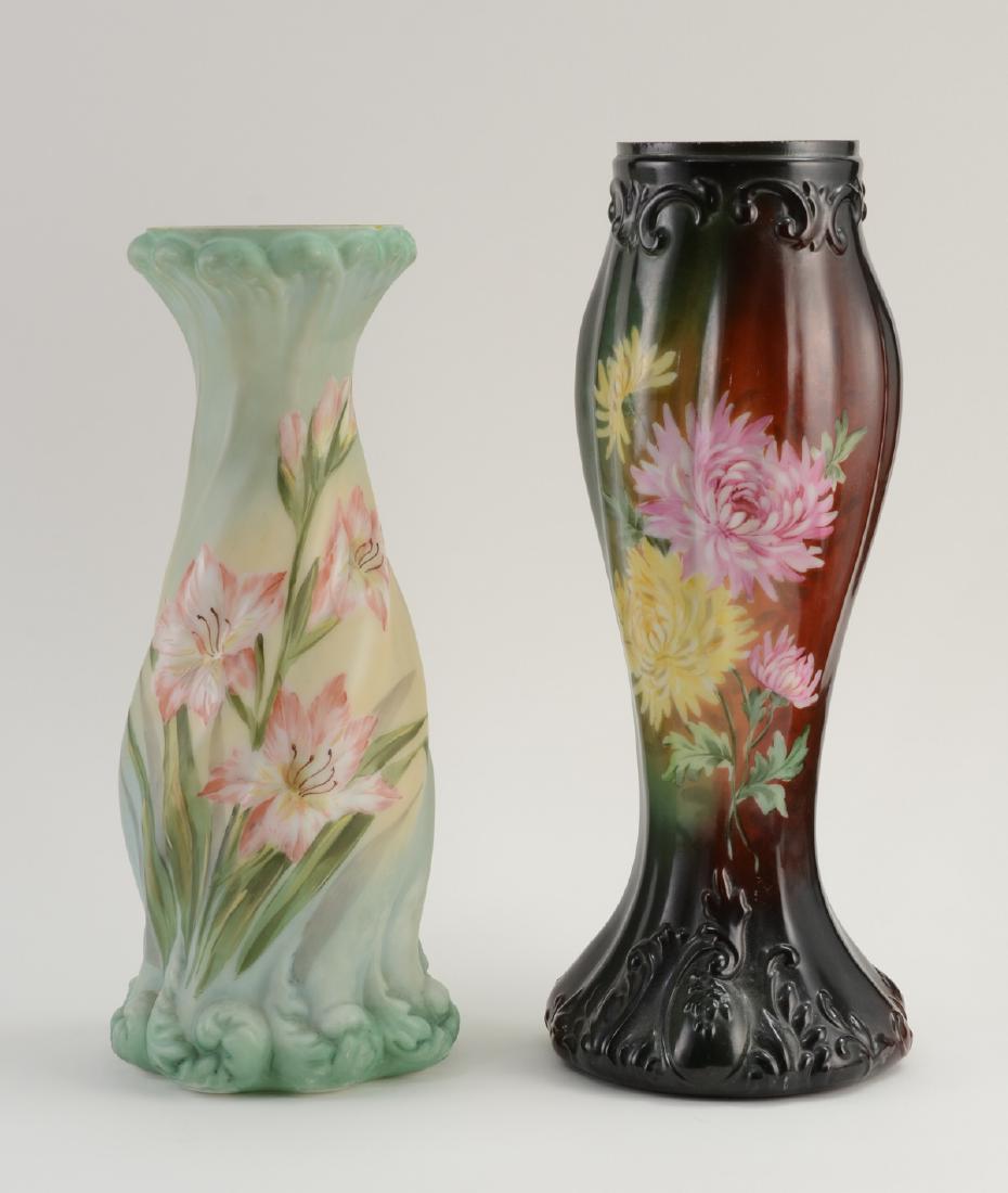 Two Handel Glass Lamp Bases: Fancy Molded Glass Lamp Bases with hand Painted Floral decoration. 12" and 11" tall. Excellent condition, good surface, no collars. The shorter with some chipping to rim. The taller signed in gold Han