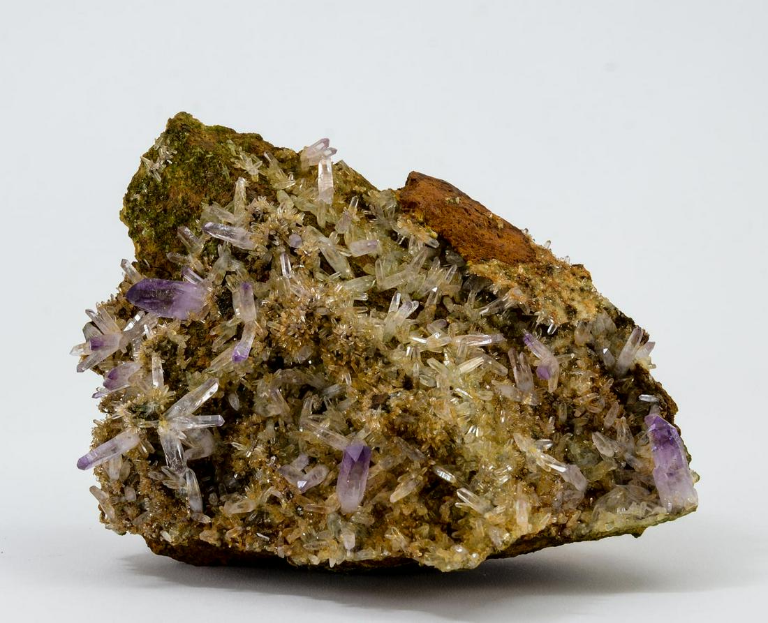 Amethyst and Epidote on Matrix: Las Vigas, Victoria Ciudad, Vera Cruz, Mexico. 1.3 kg. Ex Stone Trust. 18 cm x 14 cm x 8 cm. Keywords: Rock, Mineral, Specimen, Gem, Gemstone, Crystal, PLEASE JOIN US LIVE AFTER THE ONLINE AUCTION! Sp