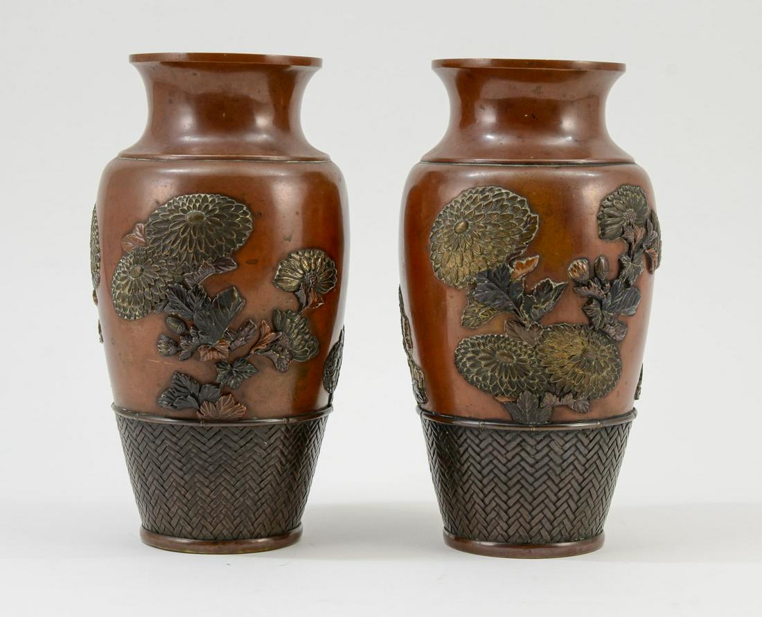 Pair of Japanese Mixed Metal Vases: Japan, Meiji Period Mixed Metal Vases with Woven and applied Silver and Bronze Chrysanthemum Decoration. Excellent old patina. Unmarked. Minor contact marks, overall very good condition, no damage or 