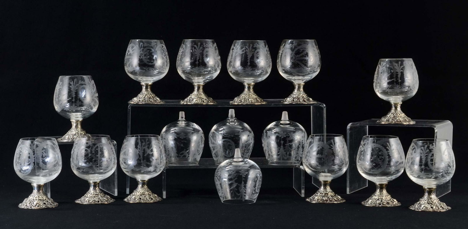 Twelve Sterling Silver German Cordial Glasses: Sterling Silver Stems with Rococo Decoration, Hallmarked Germany 925, with Wheel Cut or Engraved Bohemian Style Stag Designs. Each: 4.25" tall, Excellent Condition, With Four Spare Bowls. Late 19th or