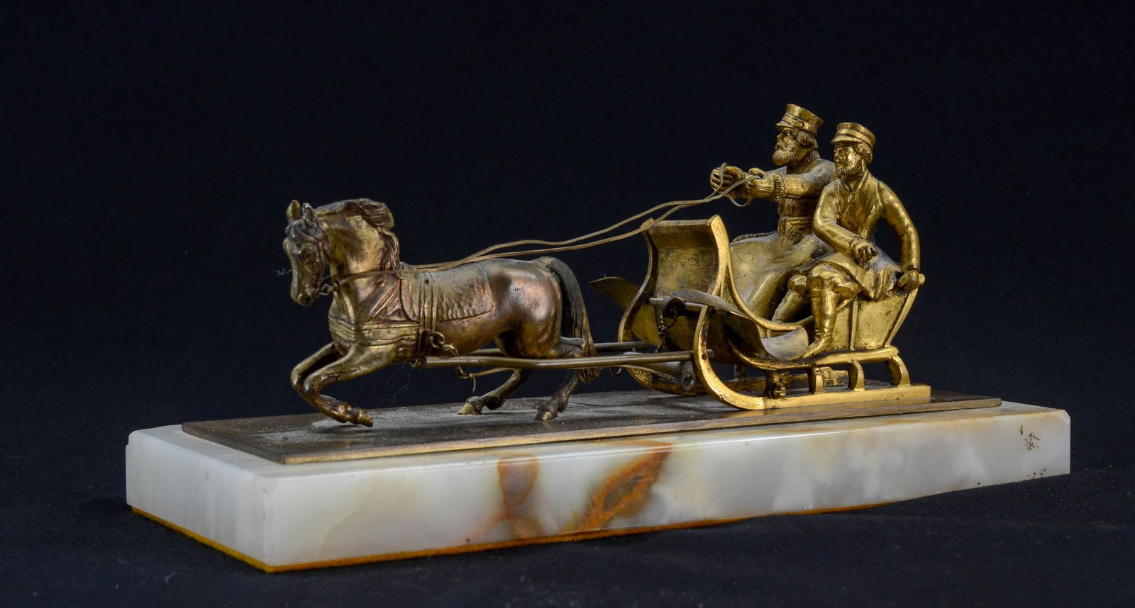 After Vassili Yacovlevitch Grachev: Gilt Bronze Figural Group with two bearded men on a horse drawn sleigh. Signed on base, not foundry mark visible. Late 19th or Early 20th Century. Very detailed, and excellent quality. Onyx Stone Plin