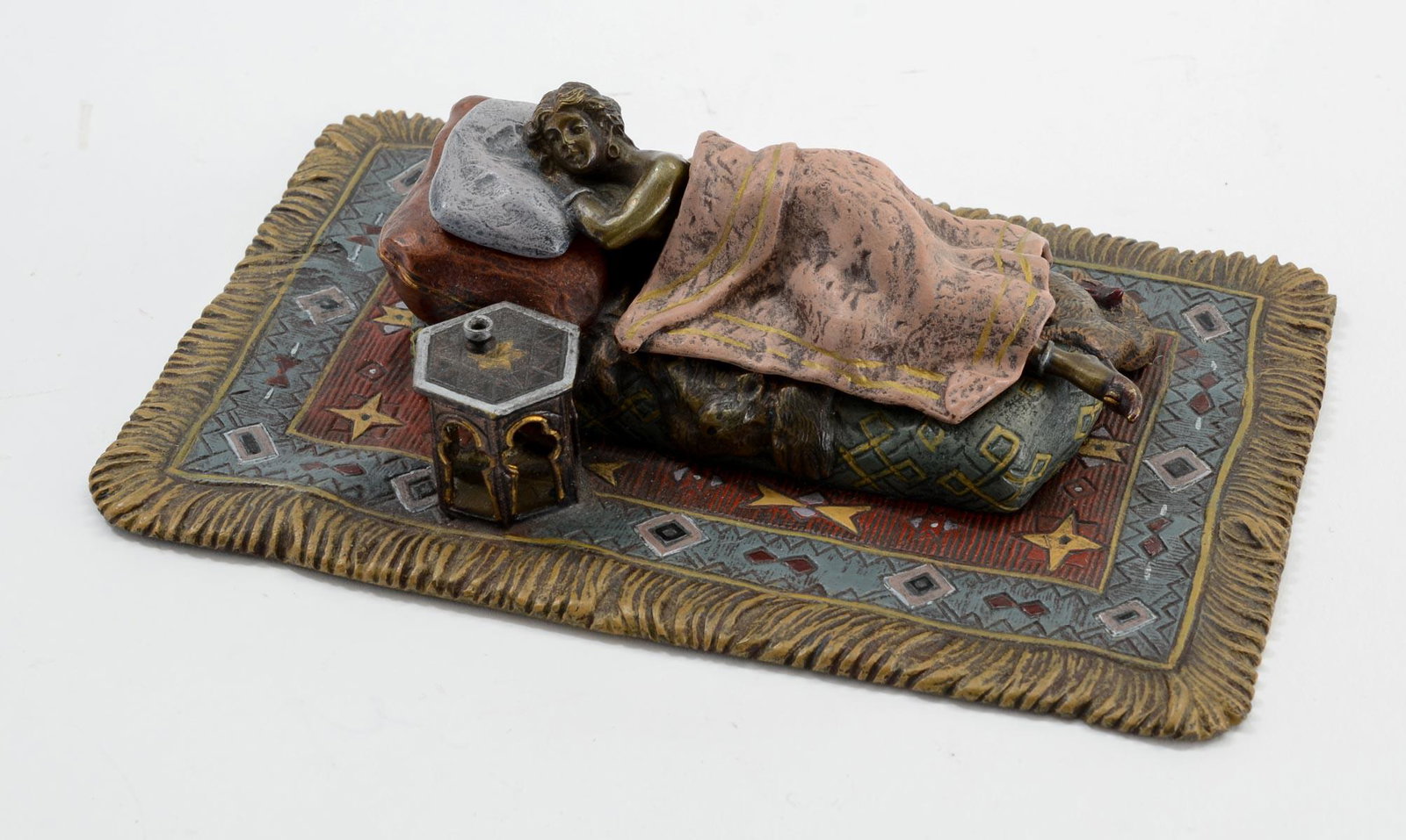 Erotic Vienna Bronze: Cold Painted Austrian Bronze with Nude under a blanket sleeping next to a table. On an oriental rug. Signed with "B" in Vase, and AUSTRIA for Franz Bergman. Very good condition, mid 20th Century. 6.5"