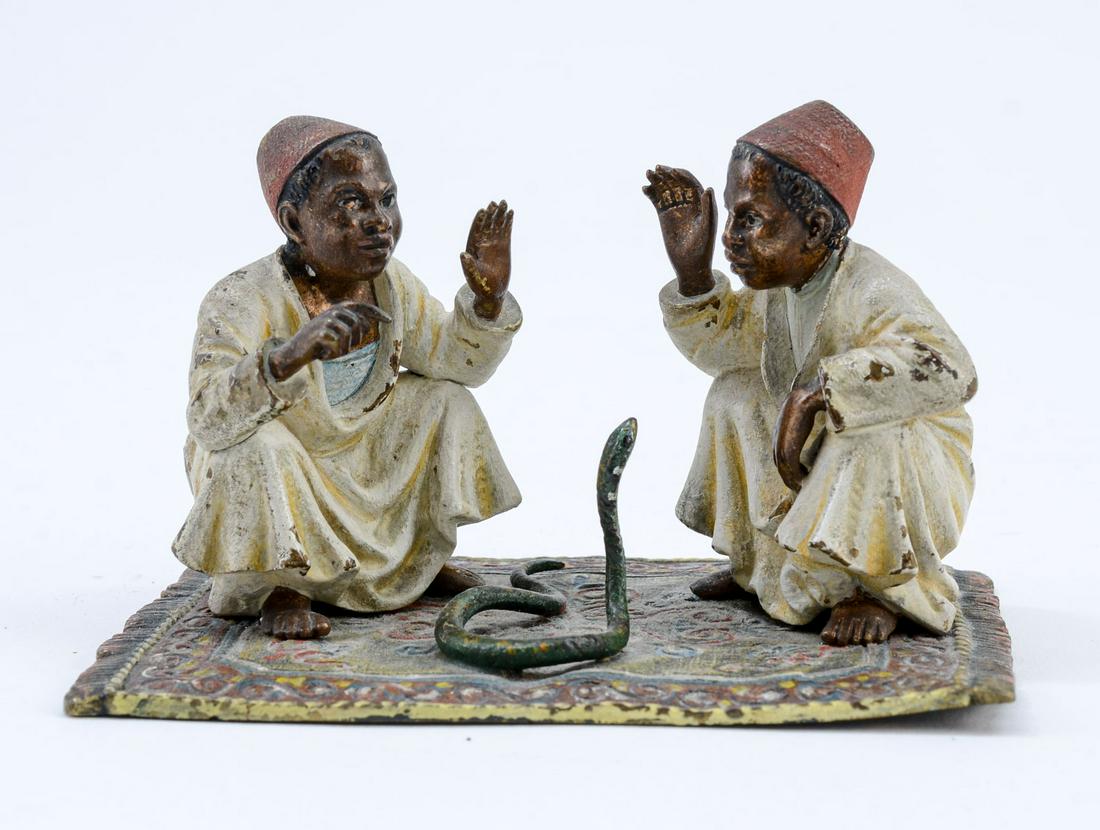 Cold Vienna Painted Bronze: Manner of Franz Bergman. Two Boys Wearing Fez Hats on an oriental rug. They are charming a snake. Unsigned, First Half 20th Century, Original Paint, minor losses. overall very good. Keywords: Austrian