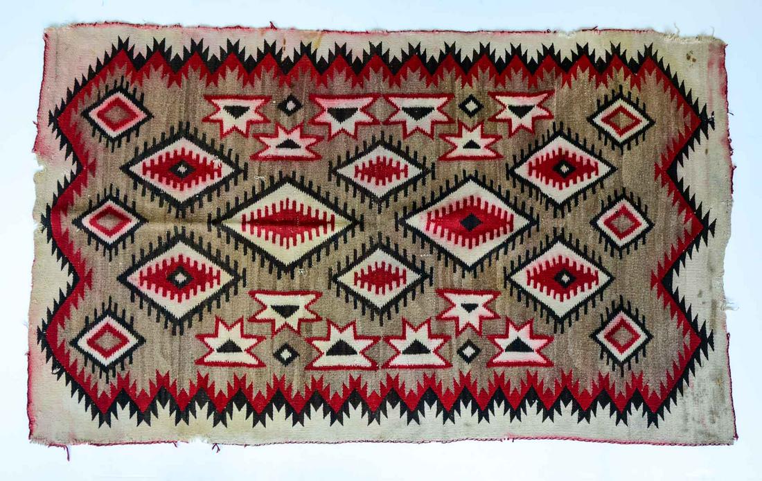 Navajo Weaving: Natural Dyed Wool Native American Weaving in Black, Natural, Brown and Red. 61" x 38" Areas of loss and holes, some red dyes has bled from moisture. Keywords: Indian, Tribal, Rug, Blanket, Antique