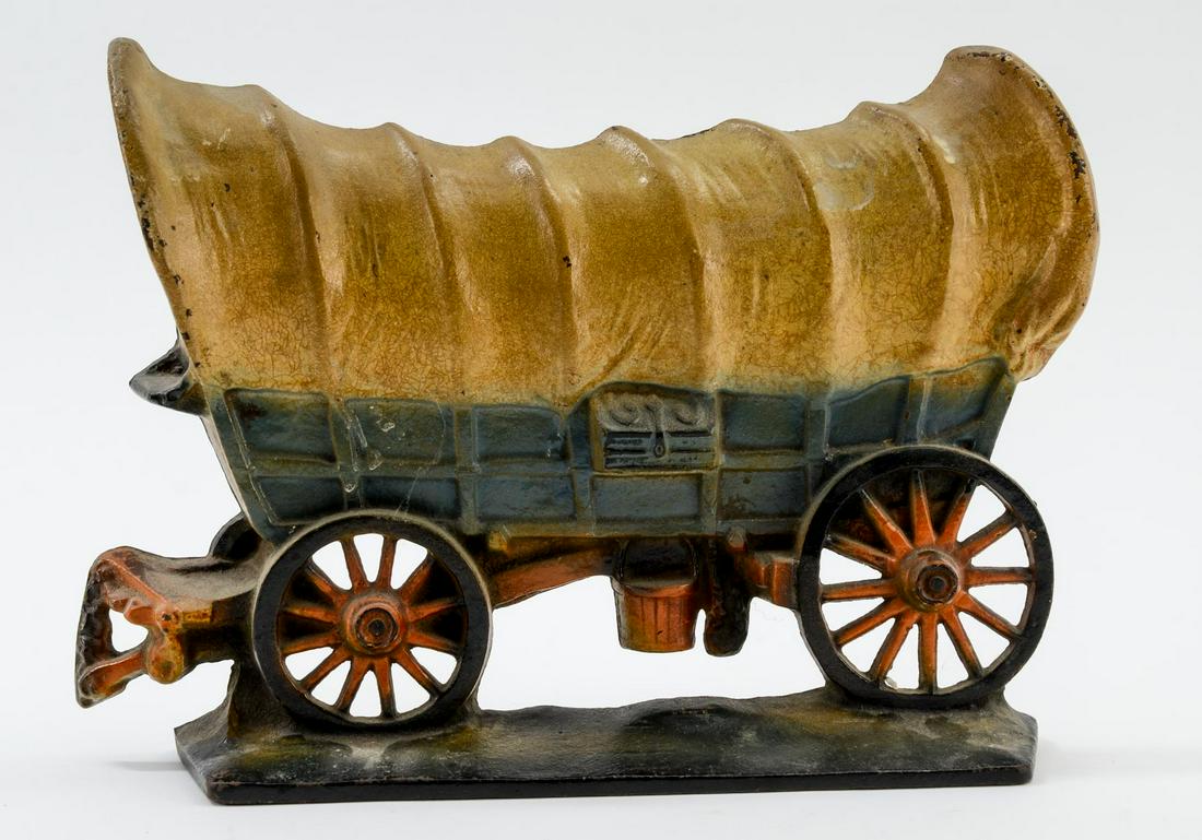 Connestoga Wagon Cast Iron Doorstop: American, 1930's Painted Cast Iron Door Stop with original paint. Marked Copyright on back. Minor paint loss, overall very good. 8.5" x 11"Keywords: Chuck Wagon, Wagon Train, Old West, Antique