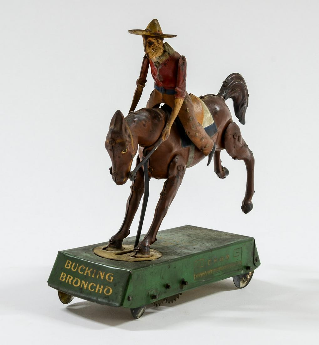 Lehmann Bucking Broncho Tin Toy: Mechanical Tin Litho Western Theme Antique Toy. Original Finish, (a bit dusty). Marke 1881 Lehmann France, Belgium, DRGM, Wild West, 525. Works intermittently. Appears Complete. Strong Surface. 7" x 7