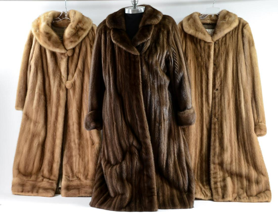 Three Ladies Estate Fur Coats: This group of furs includes a long Canadian Fur Co. of Hartford, CT dark brown color coat. Measures 47" shoulder to hem, the sleeves are 22" long and shoulder width is 19". Overall condition is good.