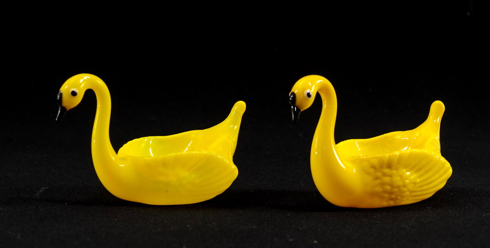 Pair Figural Yellow Glass Swan Open Salts: Pair of figural hollow yellow glass swans. Applied eyes and beaks. 1 3/4" high x 3" long x 1 1/4" wide. In excellent condition. Keywords: Salt Cellar, Salt Dip, Bimini, German, Italian, Italy, Germany