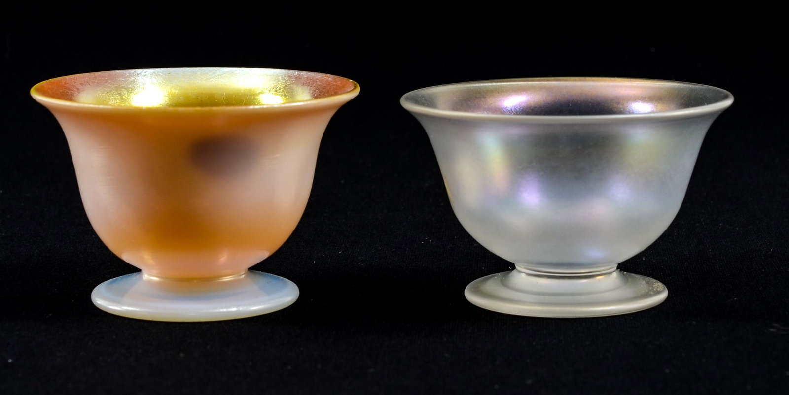 Manner of Steuben Glass Open Salts: Calcite Glass with Gold Aurene interior, together with a Verre De Soie. Each with Polished Pontils, Each Unsigned. Each 1 1/2" tall and 2 1/4" wide. Excellent Condition. Keywords: Art Glass, Salt Cell