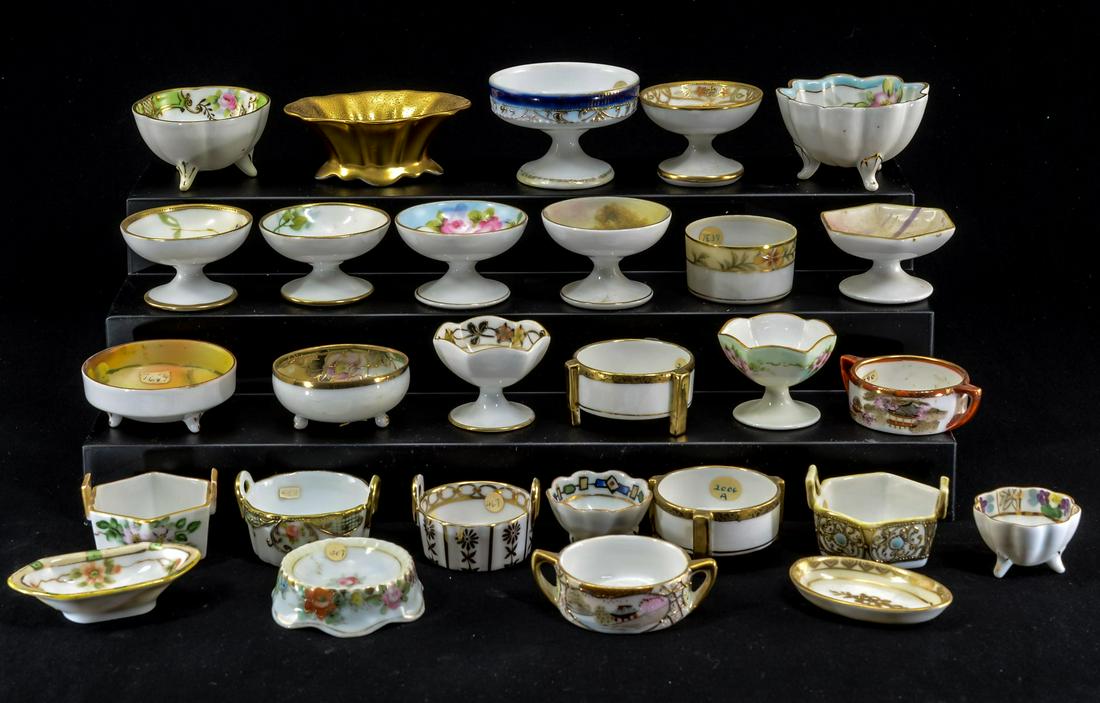 28 Nippon / Noritake Porcelain Open Salts.: Twenty nine Nippon / Noritake porcelain open salts. Most are floral pattern. Not all pieces inspected, but appear to be in good condition. Keywords: Salt Cellar, Salt Dip, Japan, Japanese