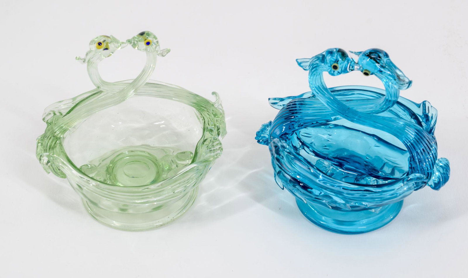 2 Venetian Glass Double Neck Swan Open Salts: Two Venetian Glass double neck swan open salts. One pale green, the other royal blue. 3 1/8" diameter x 3 1/2" high. Both in excellent condition. Keywords: Salt Cellar, Salt Dip, Italian, Art Glass