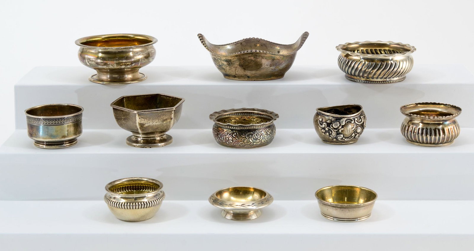 11 Gorham Sterling Silver Open Salts: Eleven Gorham sterling silver open salts. Various patterns. 4 monogrammed. 6.42 troy ozs. total. All in excellent condition. Keywords: Salt Cellar, Salt Dip, American Silver