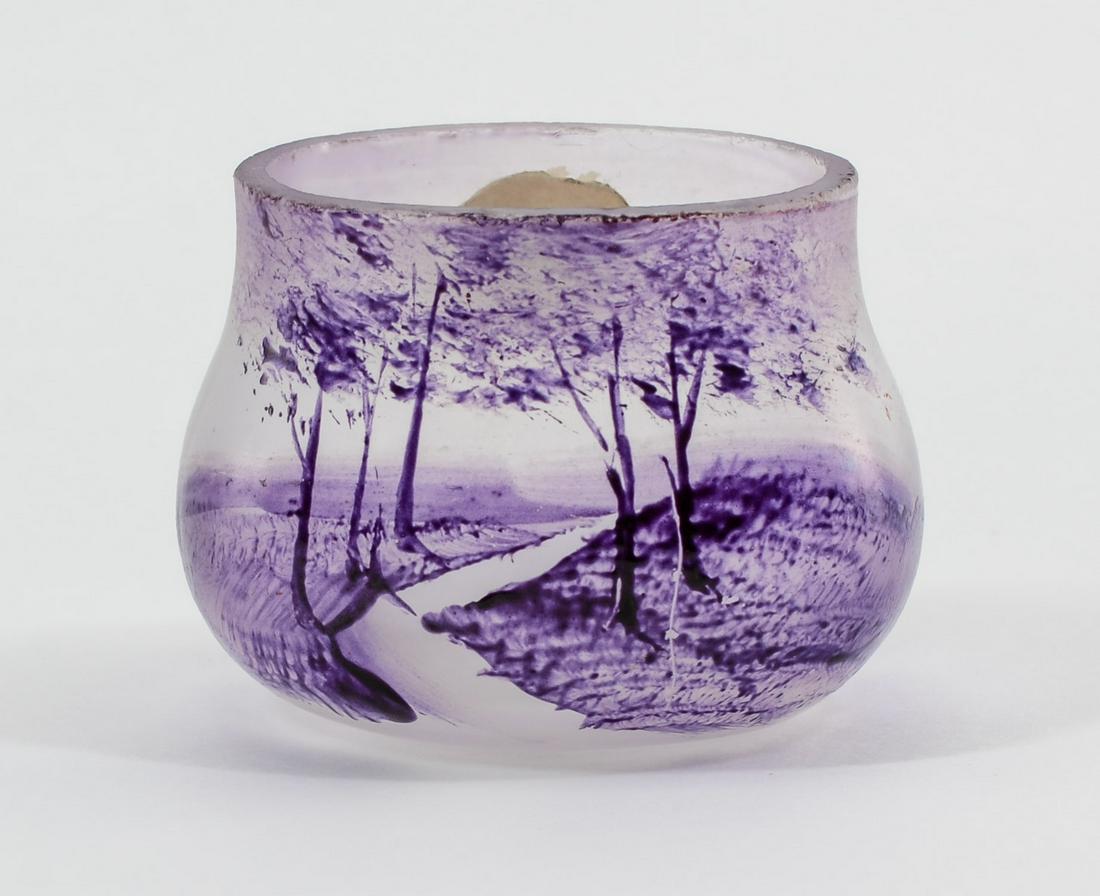 Scenic Enamel Glass Open Salt: Deep Amethyst Enamel on frosted glass with woodland scene. Unsigned. Similar period and style of Daum Nancy. 1.25" x 1.5" x 1.25". Minor rim chips. Keywords: Antique, France, Salt Cellar, Art Glass