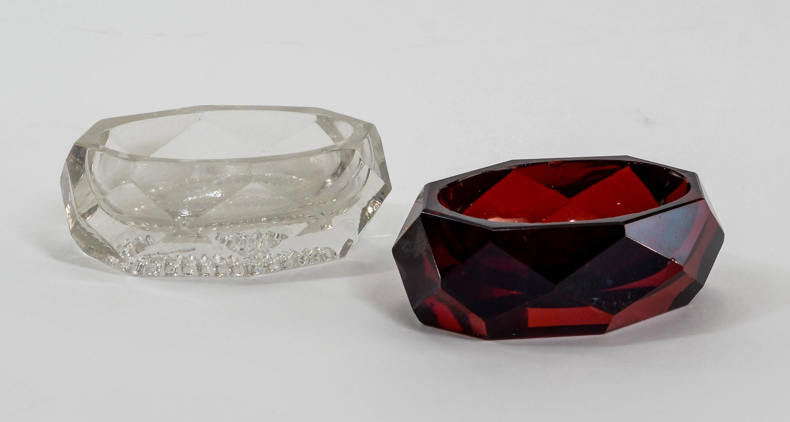 2 Faceted Glass Open Master Salts: Two Faceted glass open master salts. One clear, the other ruby. Unmarked. Possibly French or English, early Keywords: Salt Cellar, Salt Dip, Pattern Glass, Flint, Antique