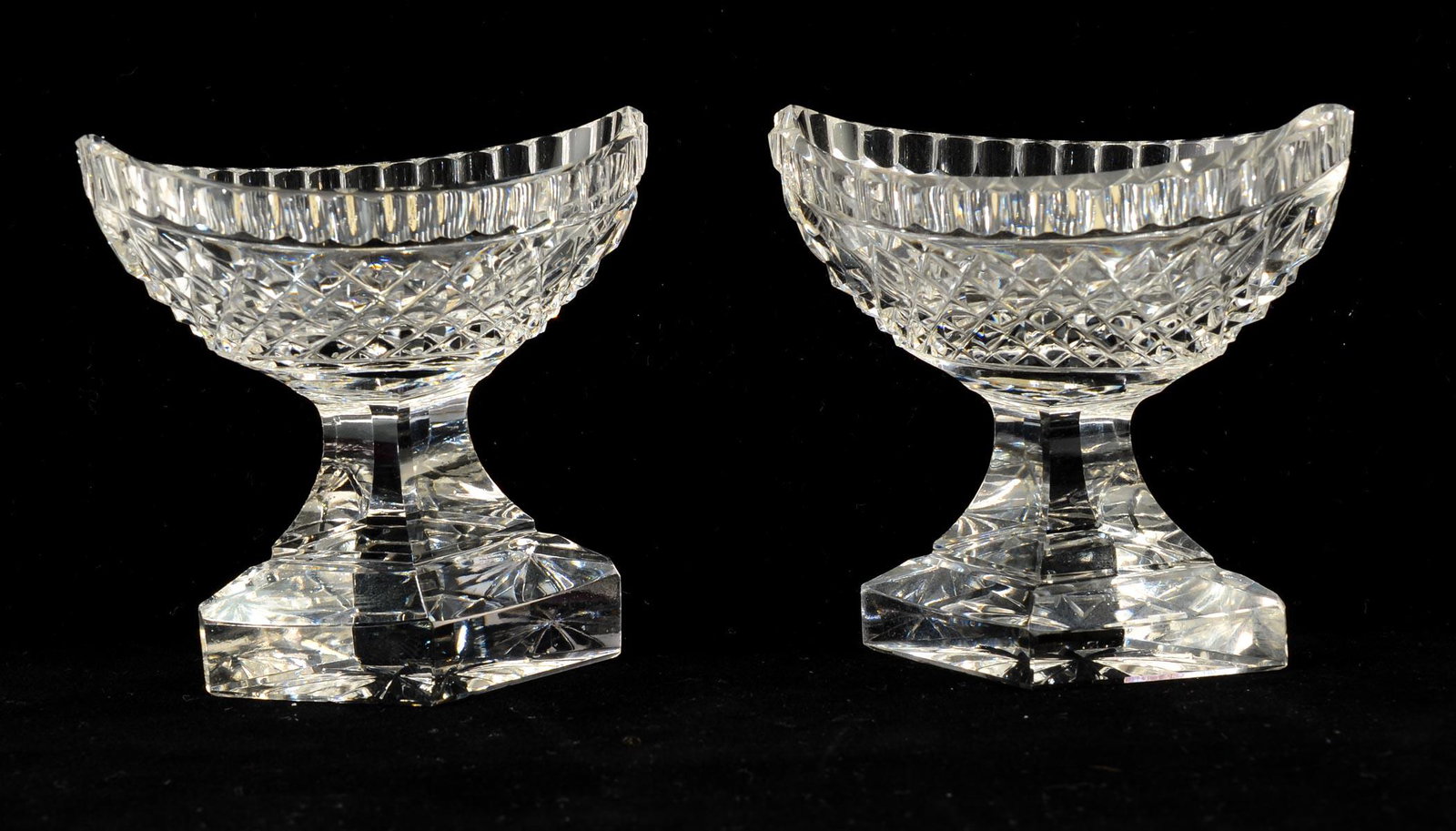 Pair of Cut Glass Open Salts: Pair of clear cut glass pedestal boat form open salts. Diamond point style pattern. 3" high x 2" wide x 3 1/2" long. Very good condition. Likely Anglo-Irish, 19th century Keywords: Salt Cellar, Salt D