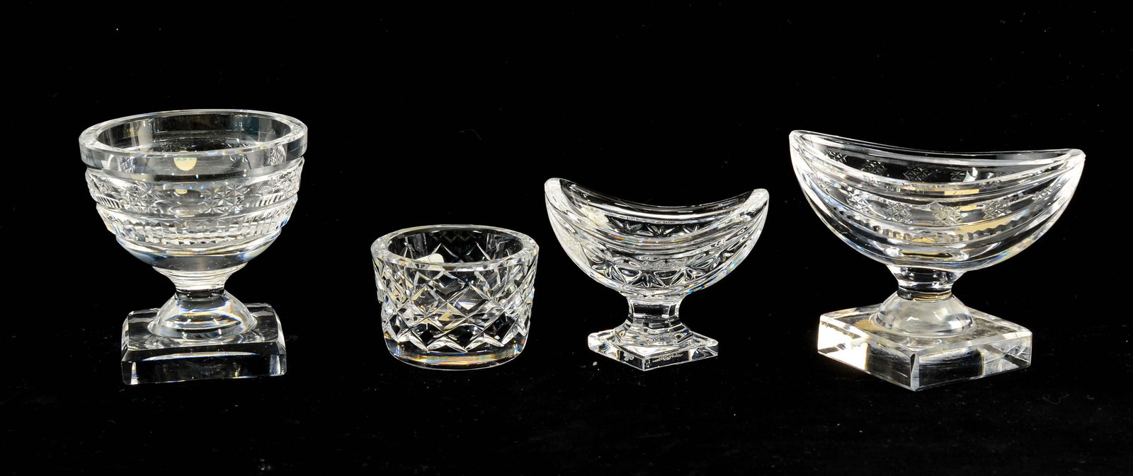 4 Waterford Crystal Open Salts: Four Waterford Crystal open salts in various patterns. Two retain paper labels. All in very good condition. Keywords: Salt Cellar, Salt Dip, Irish, Pedestal