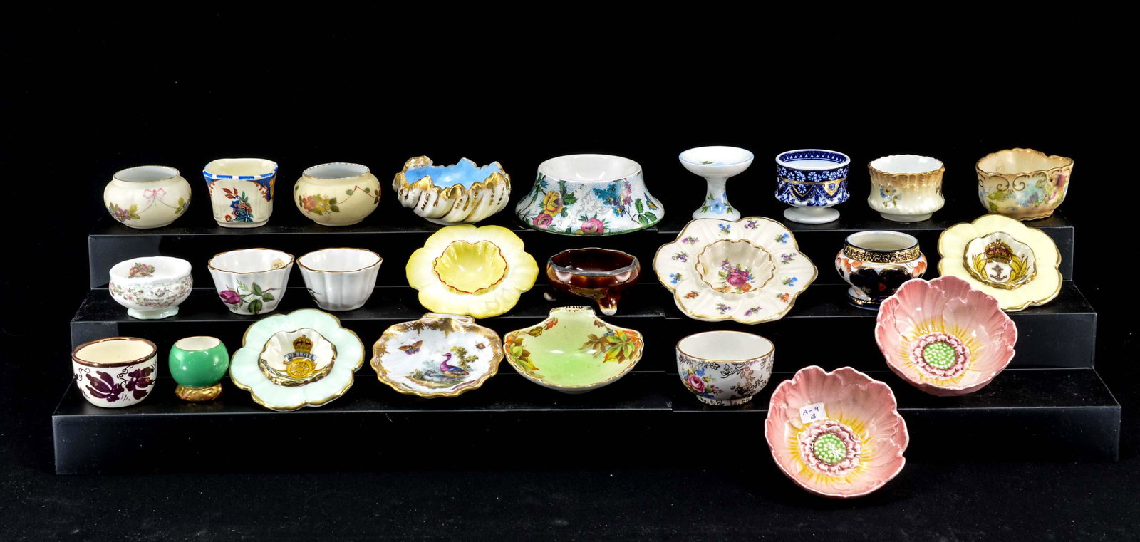 25 English Porcelain Open Salts: Twenty five English porcelain open salts. Most are floral in pattern. All appear to be in good condition, not inspected individually. Keywords: Salt Cellar, Salt Dip, Coalport, Paragon, Royal Doulton