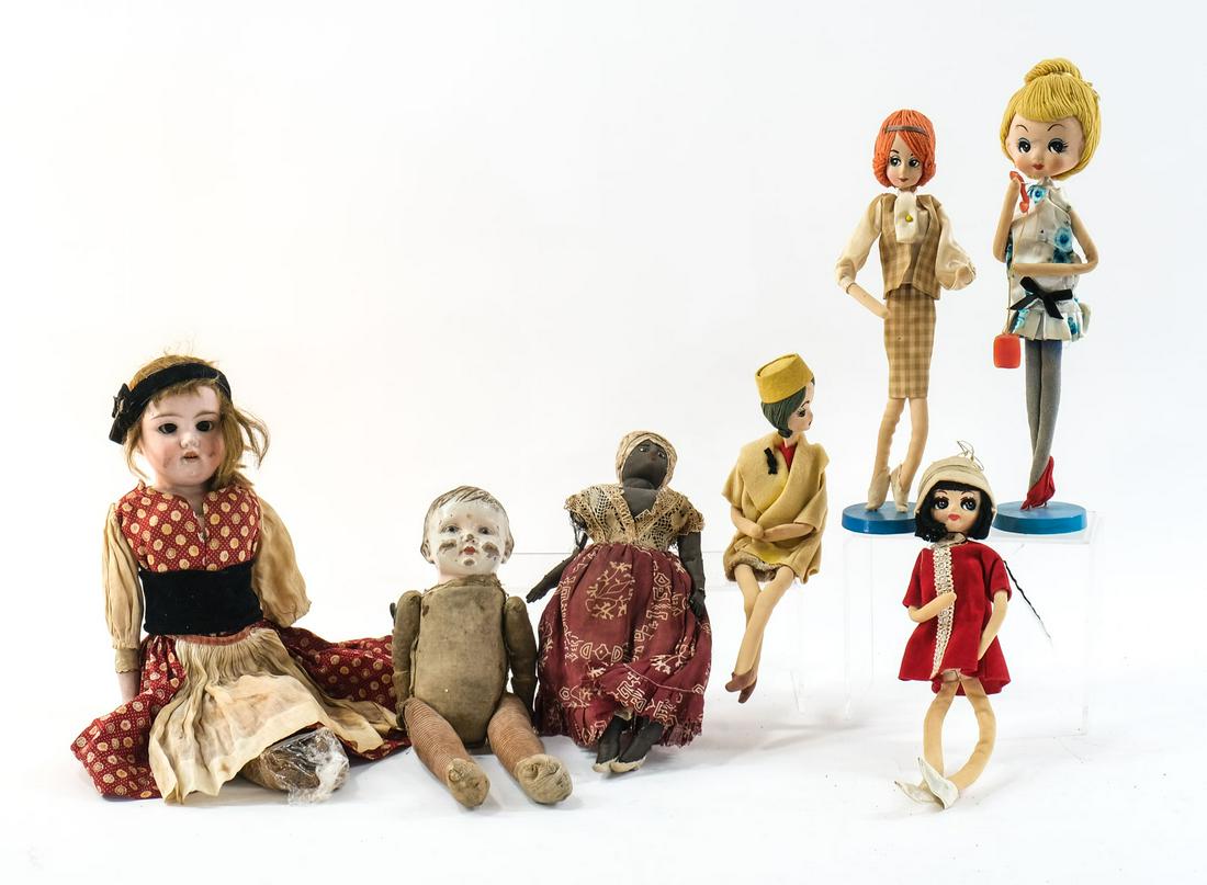 Antique and Vintage Doll Group: American, German, International, some mid 20th Century, some 19th Century including an 18" Armand Marseille Bisque-Head doll with natural hair and moving eyes. Back marked A.M.I.DEP-MADE IN GERMANY. J