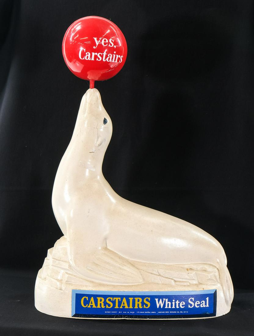 Carstairs White Seal Whiskey Advertising Figure: Composition with plastic ball. 28" x 18" some minor bumps near snout, ball separating, overall good. Keywords: Bar, Man Cave, Liquor Store, Counter top Display, sign