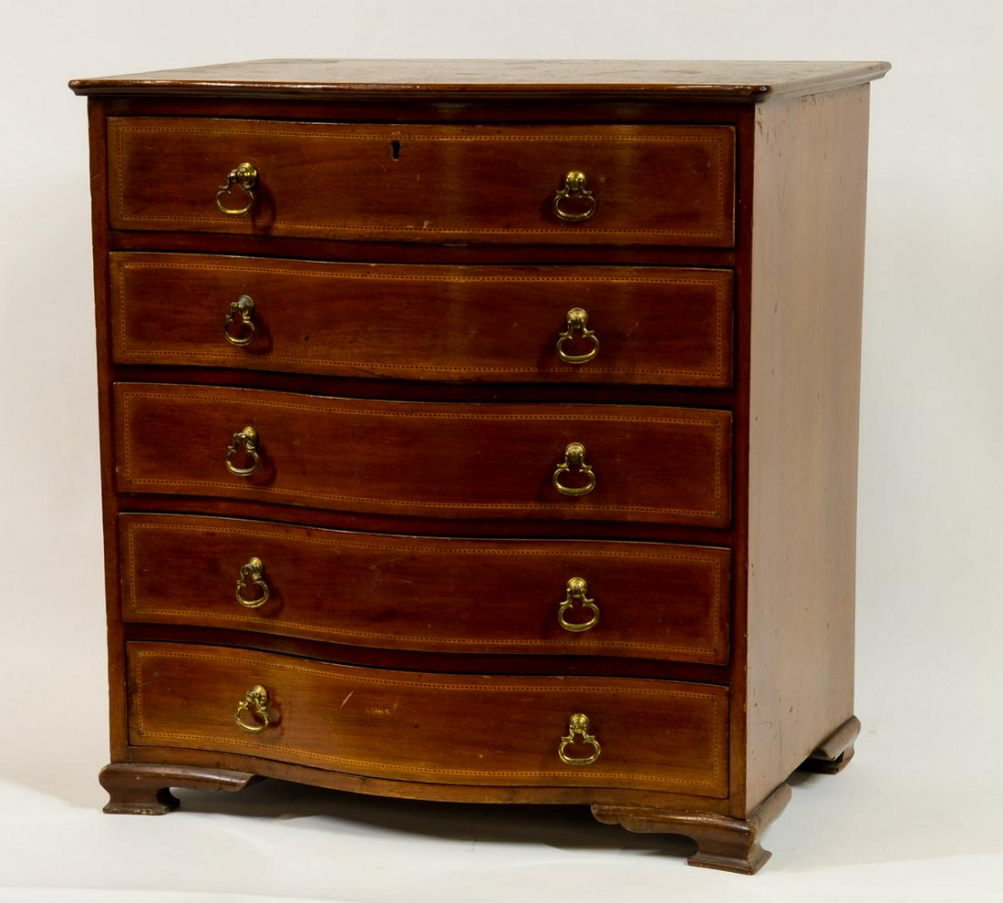 Diminutive Inlaid Chest of Drawers: Small Scale or Miniature Serpentine Front Chest or dresser, with inlay detail on the draw fronts. Fine Brass Hardware, working lock (no key). Excellent detail. Some wear to the finish on top with mark