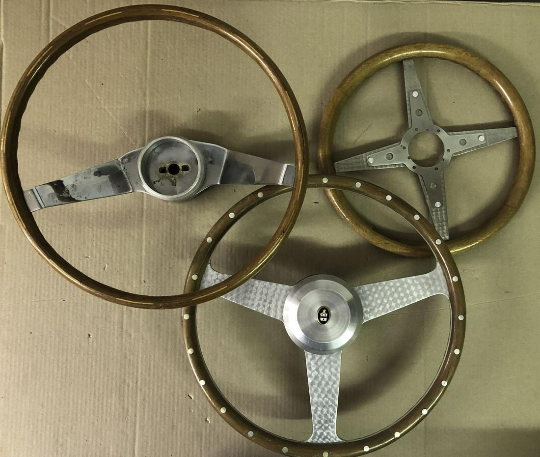 Three steering wheels - two are wood rimmed (1 of 2)