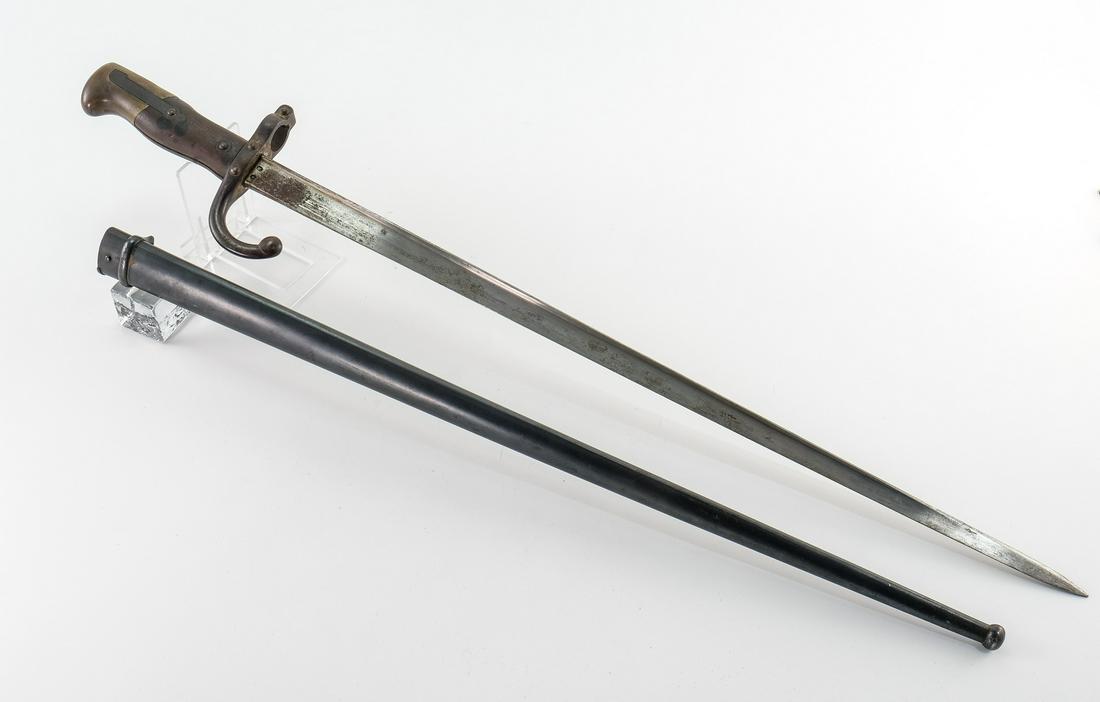 French WW1 Gras Bayonet: This lot includes one French Gras bayonet with metal scabbard. This bayonet is in good condition with moderate all over wear and a touch of rust on the blade. The top of the blade is marked with Frenc