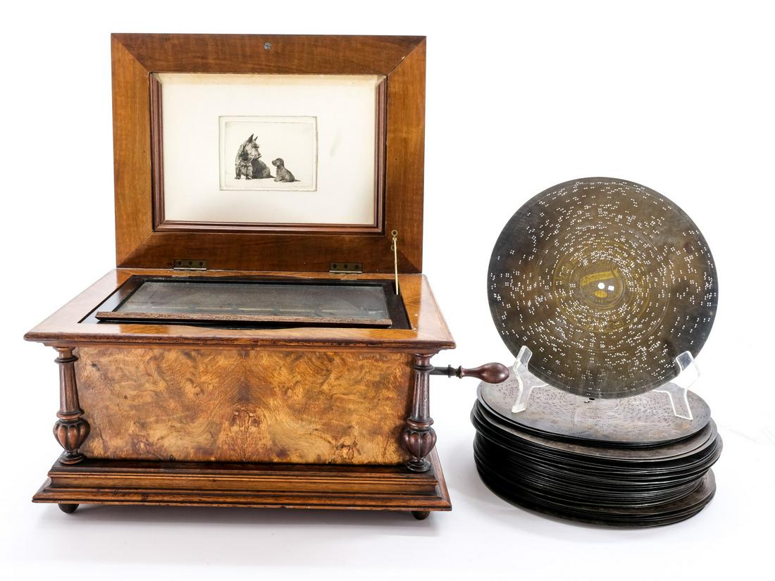 Antique Table Top Disc Player w/ 48 Discs: Unmarked, but most likely Symphonion, Germany, 19th Century. Veneered Wood Case with glass interior lid, and Bird decoration on exterior. Original Handle Hardware. Etching of Scottie dogs inside lid. 